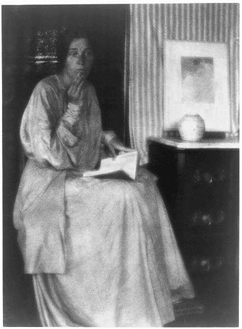 [Woman (Beatrice Baxter Ruyl), in dress with open book in...