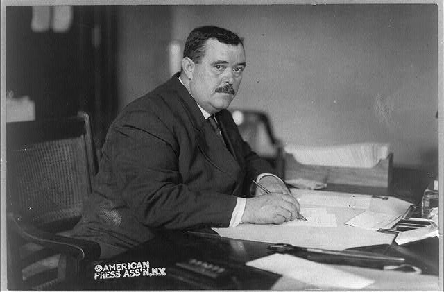 [William J. Flynn, half-length portrait, seated at desk]