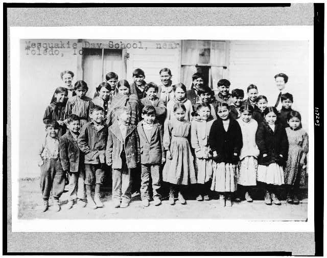 [Children and teachers posed outside of Mesquakie Day...