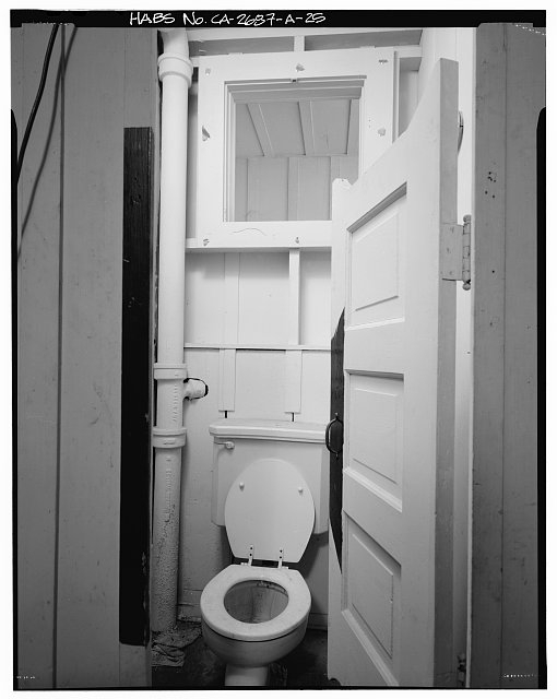 Toilet stall, bunkhouse, first floor interior, with three...