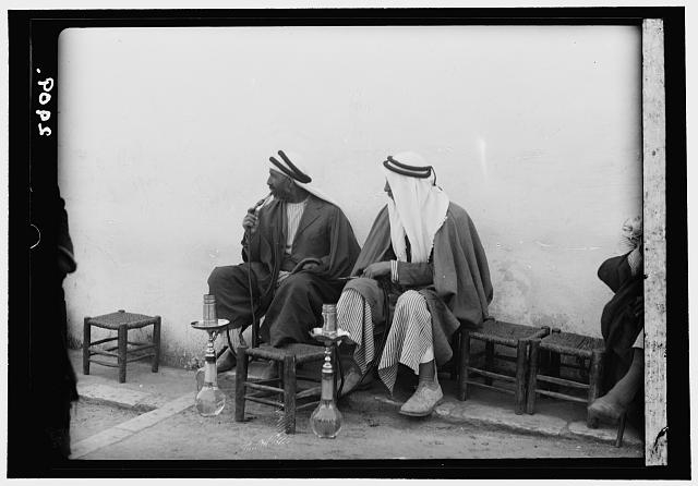 Jerusalem. The Old City. Street coffee shop. Men smoking...