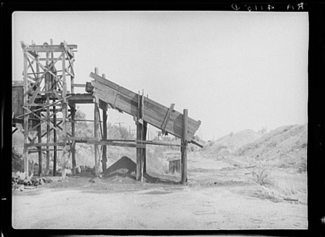 Coal mine with strip mining dumps in background. A...
