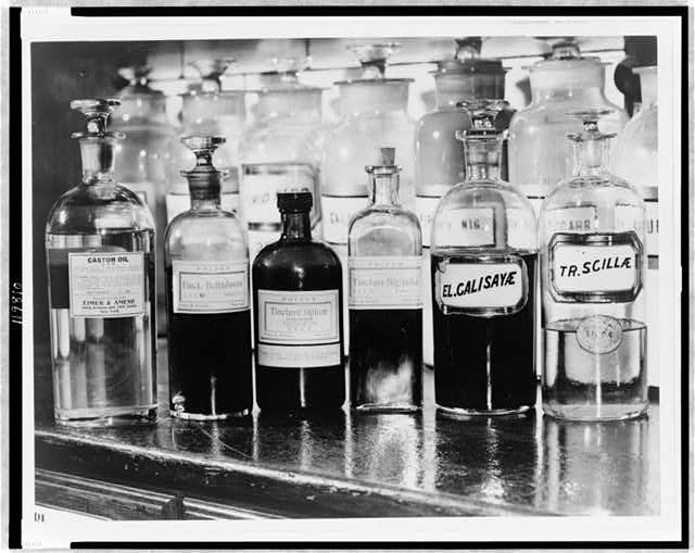 [A display of several apothecary bottles containing...